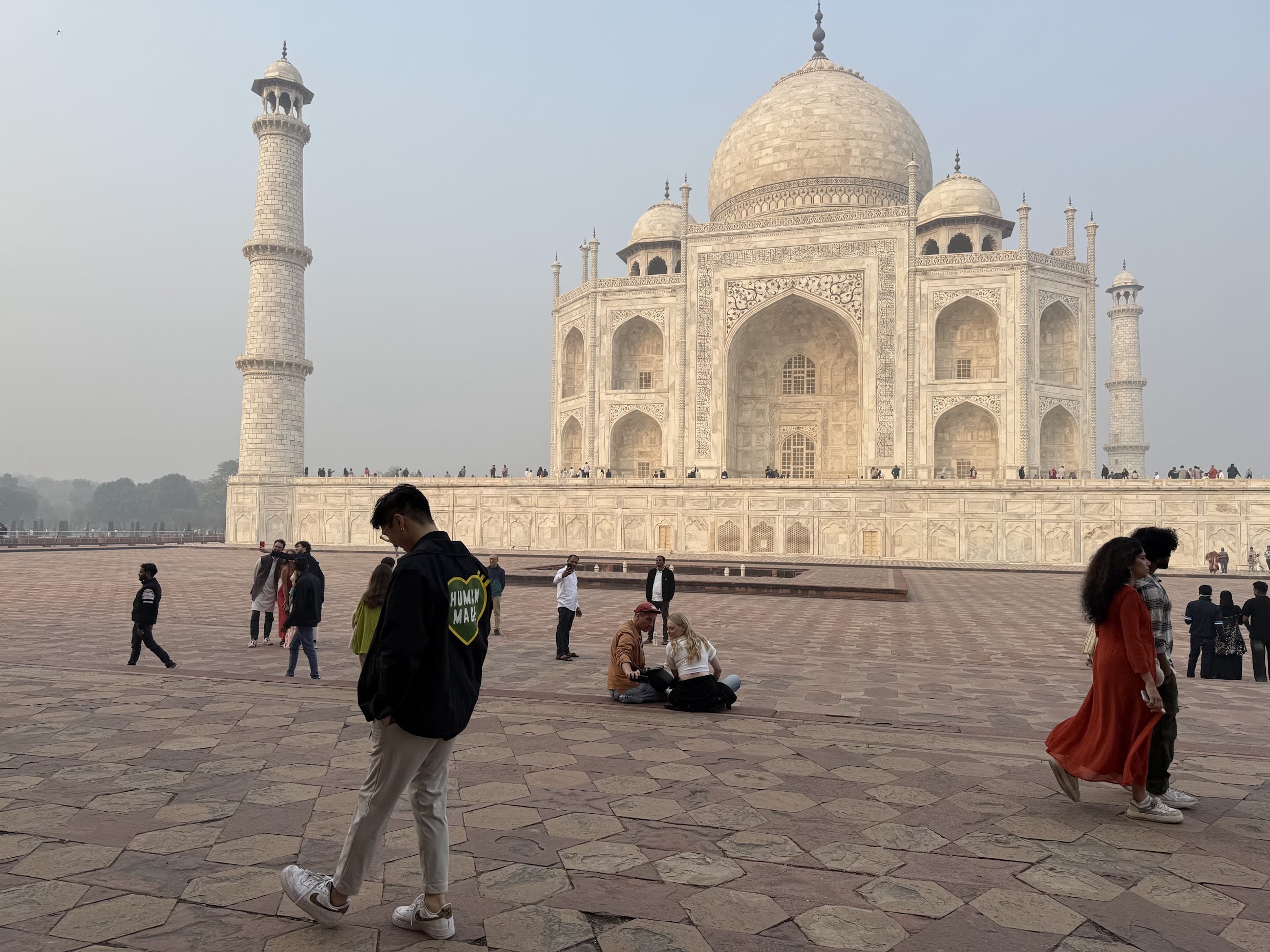 Walking across the sandstone plaza beside the Taj Mahal in the early morning light